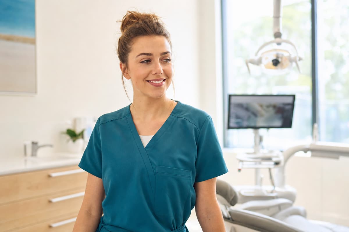 An Optimal Dental Care clinician discussing treatment options with a patient